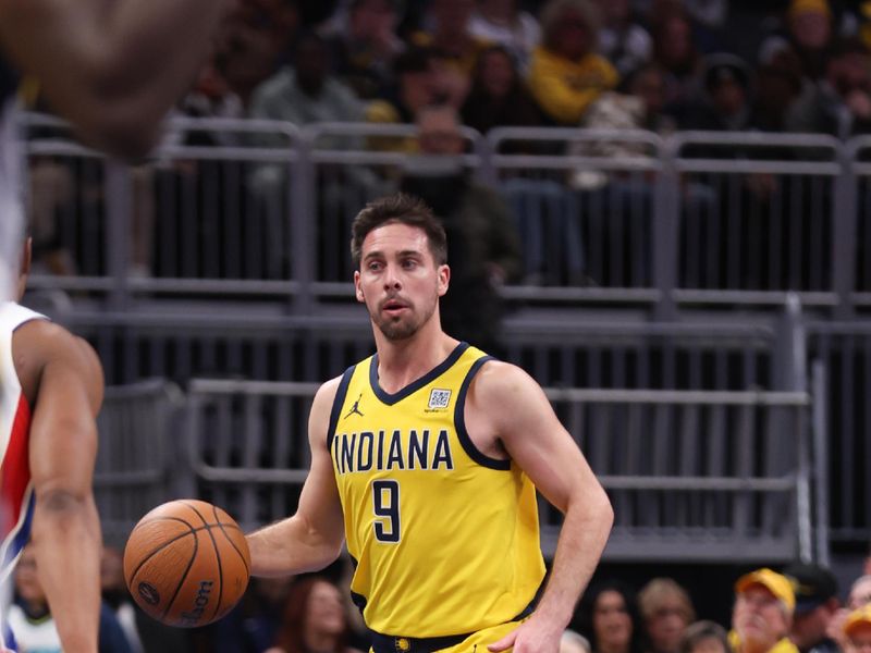 INDIANAPOLIS, IN - NOVEMBER 29: T.J. McConnell #9 of the Indiana Pacers handles the ball during the game against the Detroit Pistons during the Emirates NBA Cup game on November 29, 2024 at Gainbridge Fieldhouse in Indianapolis, Indiana. NOTE TO USER: User expressly acknowledges and agrees that, by downloading and or using this Photograph, user is consenting to the terms and conditions of the Getty Images License Agreement. Mandatory Copyright Notice: Copyright 2024 NBAE (Photo by Pepper Robinson/NBAE via Getty Images)