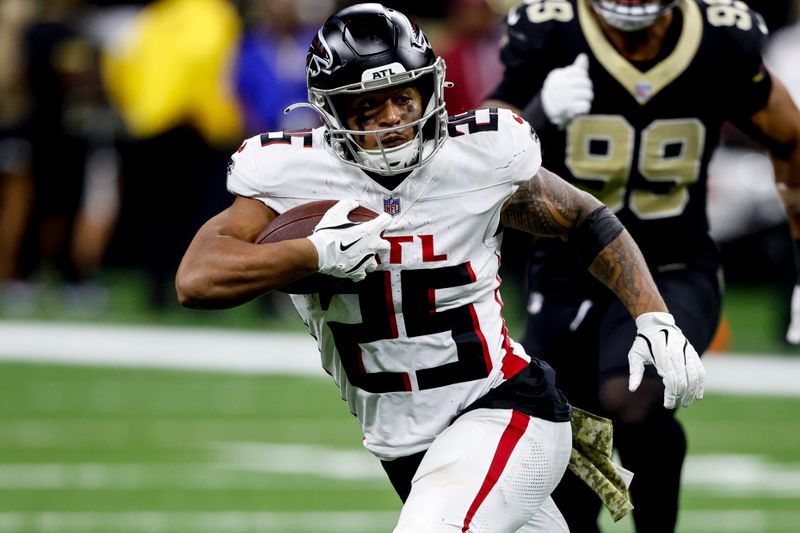 Atlanta Falcons running back Tyler Allgeier (25) runs against the New Orleans Saints during the second half of an NFL football game, Sunday, Nov. 10, 2024, in New Orleans. (AP Photo/Butch Dill)