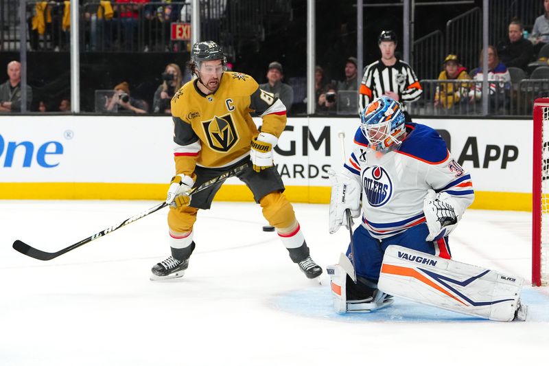 Apr 1, 2025; Las Vegas, Nevada, USA; Edmonton Oilers goaltender Calvin Pickard (30) looks to make a save as Vegas Golden Knights right wing Mark Stone (61) awaits the rebound during the second period at T-Mobile Arena. Mandatory Credit: Stephen R. Sylvanie-Imagn Images