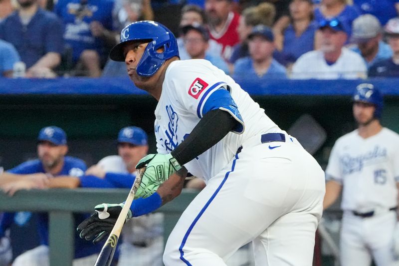 Sep 4, 2024; Kansas City, Missouri, USA; Kansas City Royals first baseman Salvador Perez (13) connects for a double against the Cleveland Guardians in the third inning at Kauffman Stadium. Mandatory Credit: Denny Medley-Imagn Images