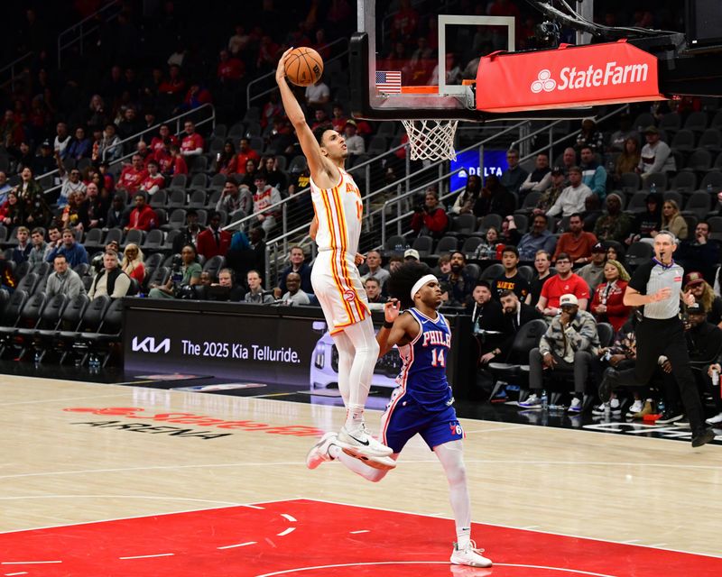 ATLANTA, GA - MARCH 10: Zaccharie Risacher #10 of the Atlanta Hawks dunks the ball during the game against the Philadelphia 76ers on March 10, 2025 at State Farm Arena in Atlanta, Georgia.  NOTE TO USER: User expressly acknowledges and agrees that, by downloading and/or using this Photograph, user is consenting to the terms and conditions of the Getty Images License Agreement. Mandatory Copyright Notice: Copyright 2025 NBAE(Photo by Adam Hagy/NBAE via Getty Images)