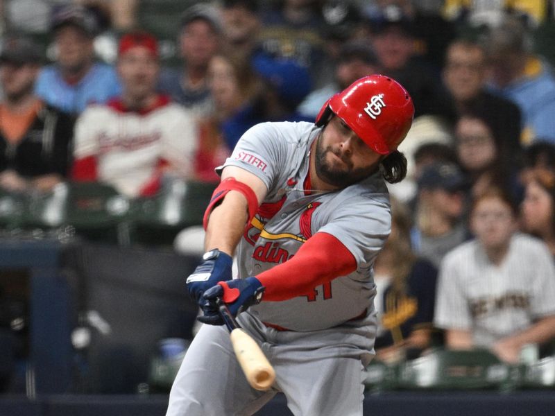 May 10, 2024; Milwaukee, Wisconsin, USA; St. Louis Cardinals outfielder Alec Burleson (41) reaches for a ball against the Milwaukee Brewers in the sixth inning at American Family Field. Mandatory Credit: Michael McLoone-USA TODAY Sports