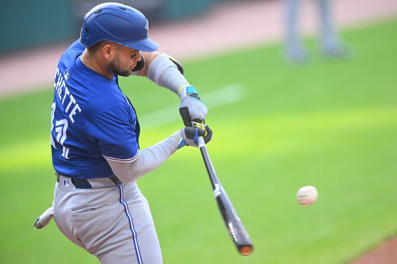 Jun 24, 2025; Cleveland, Ohio, USA; Toronto Blue Jays shortstop Bo Bichette (11) singles in the first inning against the Cleveland Guardians at Progressive Field. Mandatory Credit: David Richard-Imagn Images