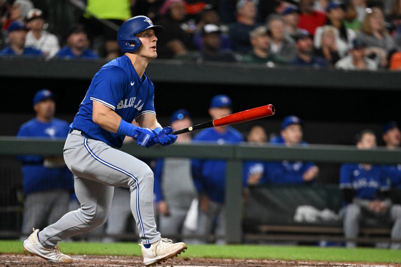 May 13, 2024; Baltimore, Maryland, USA;  Toronto Blue Jays center fielder Daulton Varsho (25) swings tthrough a seventh inning solo home run against the Baltimore Orioles at Oriole Park at Camden Yards. Mandatory Credit: Tommy Gilligan-USA TODAY Sports