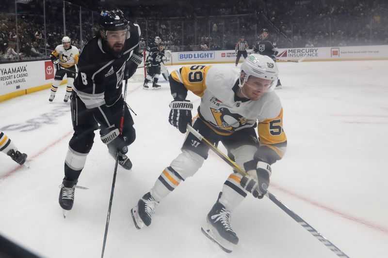 Nov 9, 2023; Los Angeles, California, USA; Los Angeles Kings defensemen Drew Doughty (8) defends against Pittsburgh Penguins left wing Jake Guentzel (59) during the first period at Crypto.com Arena. Mandatory Credit: Yannick Peterhans-USA TODAY Sports