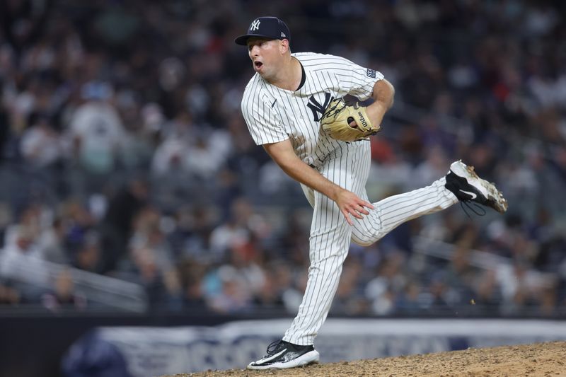 Sep 25, 2024; Bronx, New York, USA; New York Yankees relief pitcher Cody Poteet (72) follows through on a pitch against the Baltimore Orioles during the seventh inning at Yankee Stadium. Mandatory Credit: Brad Penner-Imagn Images