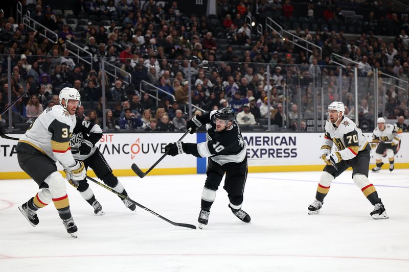 Oct 30, 2024; Los Angeles, California, USA; Los Angeles Kings left wing Tanner Jeannot (10) shoots the puck during the second period against the Vegas Golden Knights at Crypto.com Arena. Mandatory Credit: Kiyoshi Mio-Imagn Images