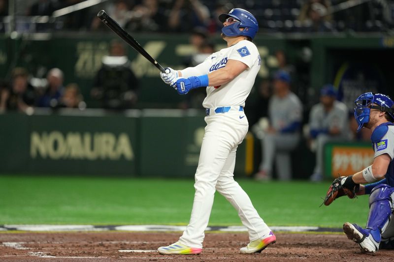 Mar 19, 2025; Bunkyo, Tokyo, JPN; Los Angeles Dodgers third baseman Enrique Hernández (8) hits a home run in the fourth inning against the Chicago Cubs during the Tokyo Series at Tokyo Dome. Mandatory Credit: Darren Yamashita-Imagn Images
