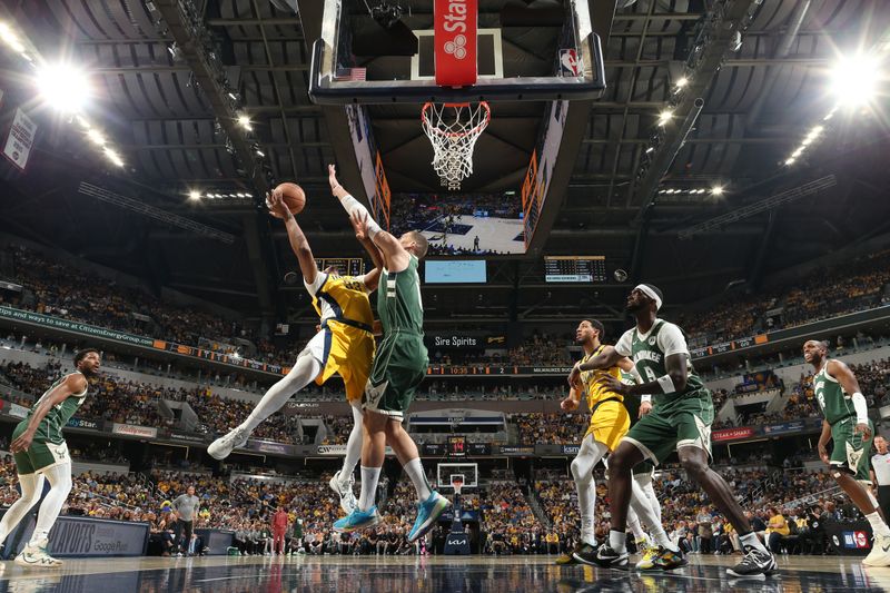 INDIANAPOLIS, IN - APRIL 28: Myles Turner #33 of the Indiana Pacers drives to the basket during the game against the Milwaukee Bucks during Round 1 Game 4 of the 2024 NBA Playoffs on April 28, 2024 at Gainbridge Fieldhouse in Indianapolis, Indiana. NOTE TO USER: User expressly acknowledges and agrees that, by downloading and or using this Photograph, user is consenting to the terms and conditions of the Getty Images License Agreement. Mandatory Copyright Notice: Copyright 2024 NBAE (Photo by Nathaniel S. Butler/NBAE via Getty Images)
