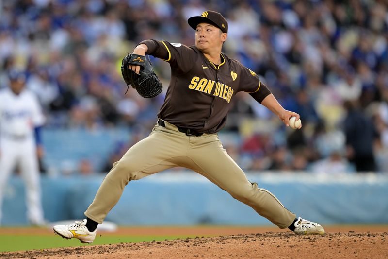 Apr 14, 2024; Los Angeles, California, USA; San Diego Padres pitcher Yuki Matsui (1) throws to the plate in the seventh inning against the Los Angeles Dodgers at Dodger Stadium. Mandatory Credit: Jayne Kamin-Oncea-USA TODAY Sports