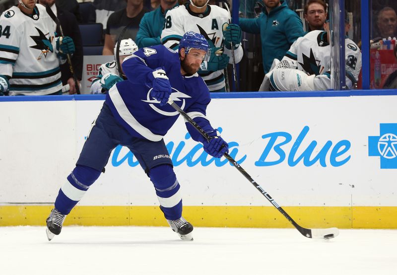 Oct 26, 2023; Tampa, Florida, USA; Tampa Bay Lightning defenseman Calvin de Haan (44) passes the puck against the San Jose Sharks during the first period at Amalie Arena. Mandatory Credit: Kim Klement Neitzel-USA TODAY Sports