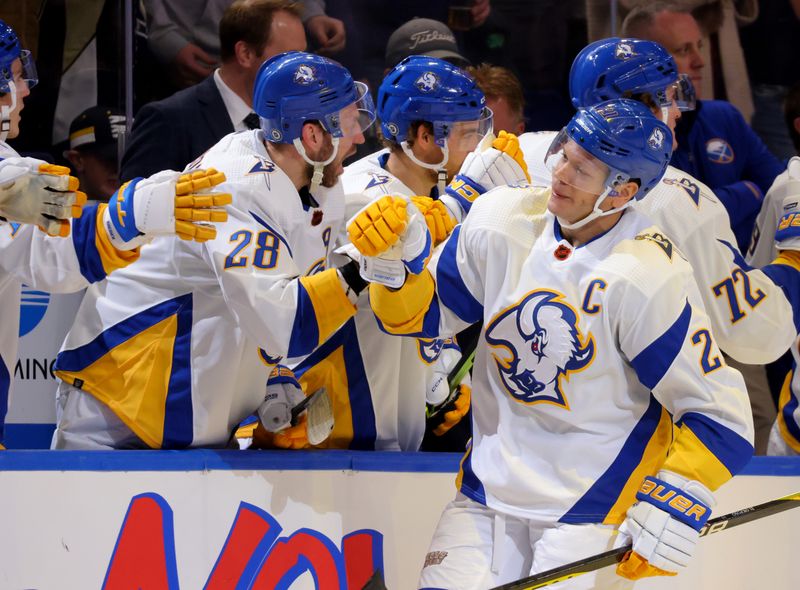 Dec 9, 2022; Buffalo, New York, USA;  Buffalo Sabres right wing Kyle Okposo (21) celebrates his goal with teammates during the third period against the Pittsburgh Penguins at KeyBank Center. Mandatory Credit: Timothy T. Ludwig-USA TODAY Sports