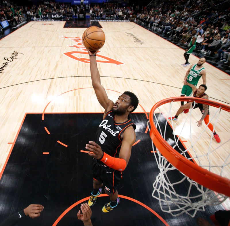 DETROIT, MI - MARCH 22: Chimezie Metu #5 of the Detroit Pistons grabs a rebound during the game against the Boston Celtics on March 22, 2024 at Little Caesars Arena in Detroit, Michigan. NOTE TO USER: User expressly acknowledges and agrees that, by downloading and/or using this photograph, User is consenting to the terms and conditions of the Getty Images License Agreement. Mandatory Copyright Notice: Copyright 2024 NBAE (Photo by Brian Sevald/NBAE via Getty Images)