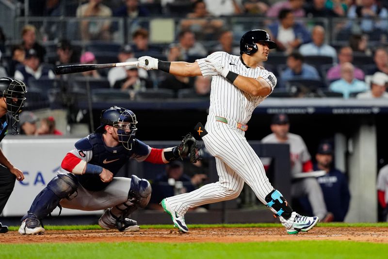 Sep 12, 2024; Bronx, New York, USA; New York Yankees left fielder Jasson Dominguez (89) hits a single against the Boston Red Sox during the second inning at Yankee Stadium. Mandatory Credit: Gregory Fisher-Imagn Images