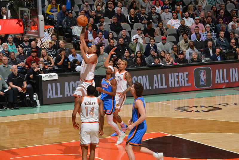 SAN ANTONIO, TX - JANUARY 24: Devin Vassell #24 of the San Antonio Spurs drives to the basket during the game against the Oklahoma City Thunder on January 24, 2023 at the Frost Bank Center in San Antonio, Texas. NOTE TO USER: User expressly acknowledges and agrees that, by downloading and or using this photograph, user is consenting to the terms and conditions of the Getty Images License Agreement. Mandatory Copyright Notice: Copyright 2024 NBAE (Photos by Jesse D. Garrabrant/NBAE via Getty Images)