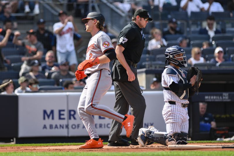 Jun 20, 2024; Bronx, New York, USA; Baltimore Orioles shortstop Gunnar Henderson (2) scores a run on a RBI single by Baltimore Orioles first baseman Ryan O'Hearn (not pictured) during the first inning against the New York Yankees at Yankee Stadium. Mandatory Credit: John Jones-USA TODAY Sports