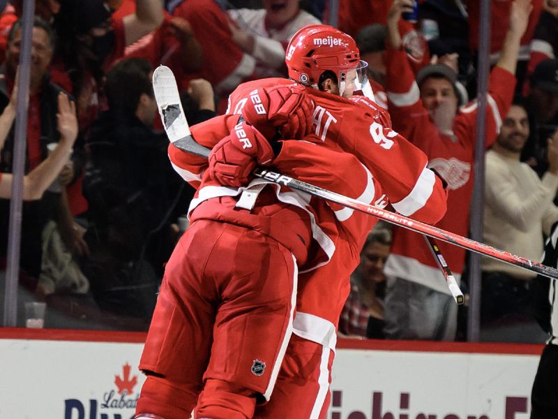 Oct 24, 2023; Detroit, Michigan, USA; Detroit Red Wings right wing Alex DeBrincat (93) celebrates with defenseman Moritz Seider (53)after scoring a power play goal against the Seattle Kraken in the third period at Little Caesars Arena. Mandatory Credit: Lon Horwedel-USA TODAY Sports