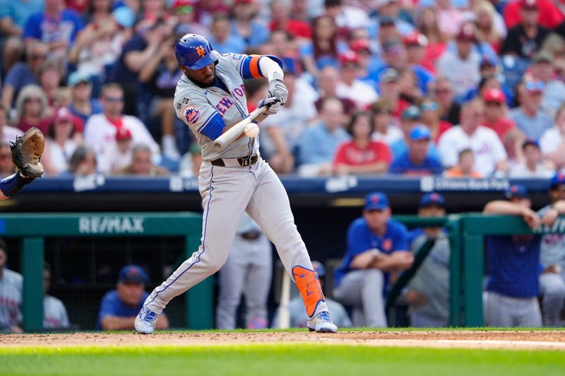 Sep 14, 2024; Philadelphia, Pennsylvania, USA; New York Mets right fielder Starling Marte (6) hits an RBI triple against the Philadelphia Phillies during the third inning at Citizens Bank Park. Mandatory Credit: Gregory Fisher-Imagn Images