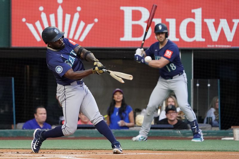May 3, 2025; Arlington, Texas, USA; Seattle Mariners manager Dan Wilson (6) breaks his bat on a foul ball during the first inning against the Texas Rangers at Globe Life Field. Mandatory Credit: Raymond Carlin III-Imagn Images