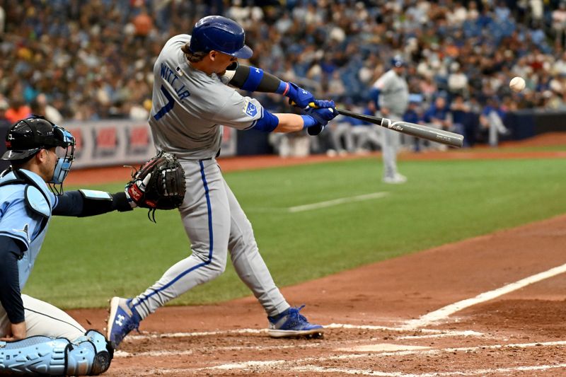 May 26, 2024; St. Petersburg, Florida, USA; Kansas City Royals shortstop Bobby Witt Jr. (7) hits a solo home run in the sixth inning against the Tampa Bay Rays at Tropicana Field. Mandatory Credit: Jonathan Dyer-USA TODAY Sports