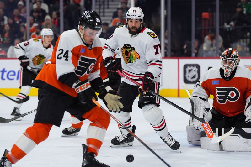 Nov 23, 2024; Philadelphia, Pennsylvania, USA; Chicago Blackhawks left wing Patrick Maroon (77) watches the puck against the Philadelphia Flyers in the second period at Wells Fargo Center. Mandatory Credit: Kyle Ross-Imagn Images