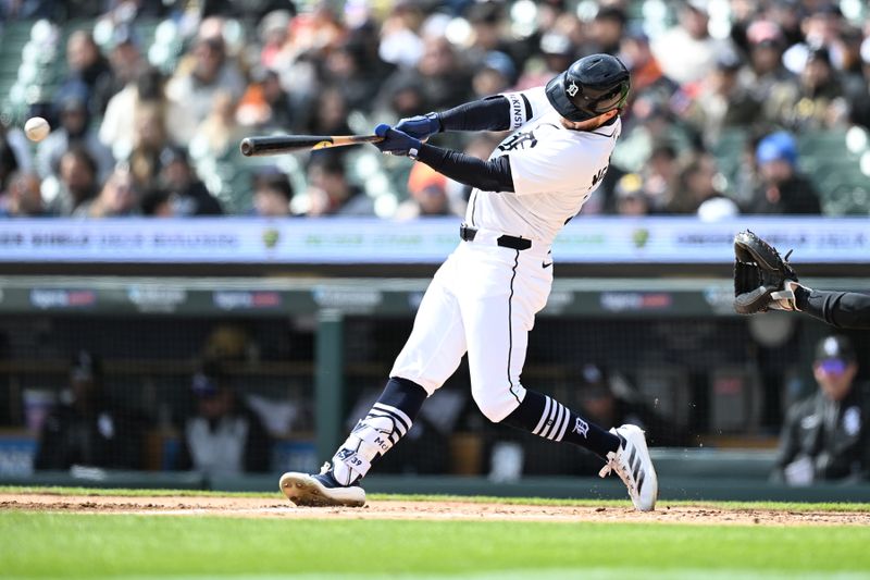 Apr 6, 2025; Detroit, Michigan, USA;  Detroit Tigers second baseman Zach McKinstry (39) hits a single against the Chicago White Sox  in the third inning at Comerica Park. Mandatory Credit: Lon Horwedel-Imagn Images