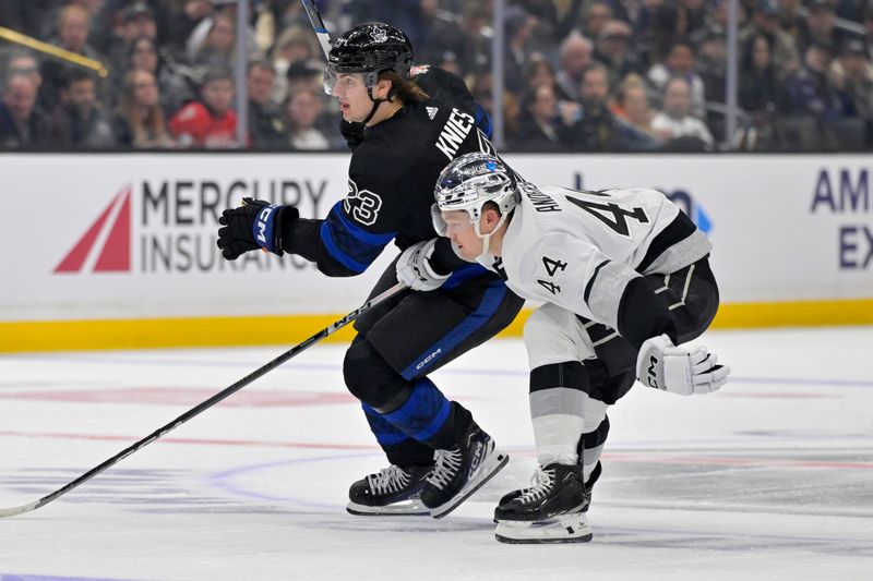 Jan 2, 2024; Los Angeles, California, USA; Toronto Maple Leafs left wing Matthew Knies (23) and Los Angeles Kings defenseman Mikey Anderson (44) chase down the puck in the first period at Crypto.com Arena. Mandatory Credit: Jayne Kamin-Oncea-USA TODAY Sports