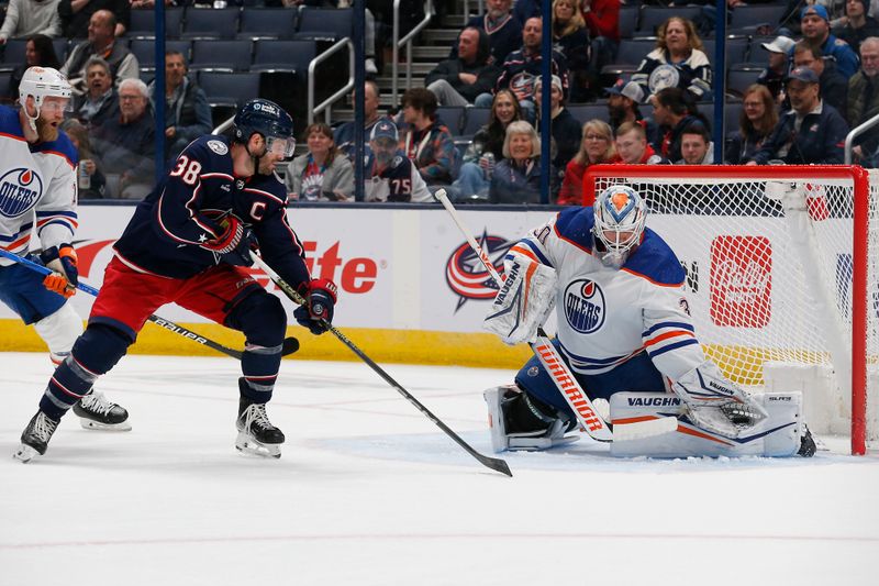 Mar 7, 2024; Columbus, Ohio, USA; Edmonton Oilers goalie Calvin Pickard (30) makes a glove save as Columbus Blue Jackets center Boone Jenner (38) looks for a rebound during the first period at Nationwide Arena. Mandatory Credit: Russell LaBounty-USA TODAY Sports