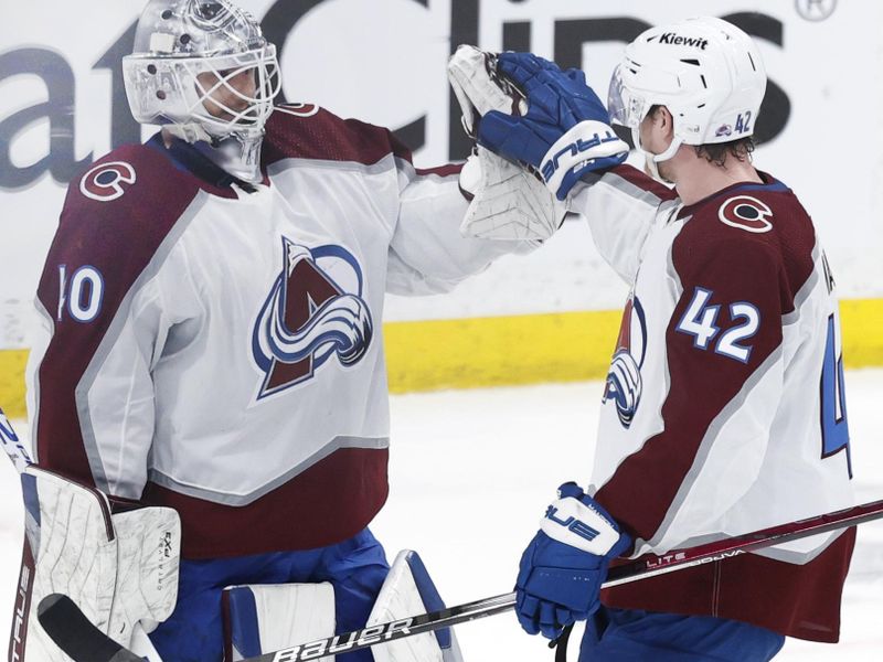 Apr 30, 2024; Winnipeg, Manitoba, CAN; Colorado Avalanche goaltender Alexandar Georgiev (40) and Colorado Avalanche defenseman Josh Manson (42) celebrate their victory over the Winnipeg Jets in game five of the first round of the 2024 Stanley Cup Playoffs at Canada Life Centre. Mandatory Credit: James Carey Lauder-USA TODAY Sports