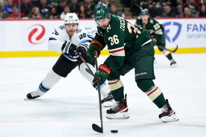 Jan 23, 2025; Saint Paul, Minnesota, USA; Minnesota Wild right wing Mats Zuccarello (36) skates with the puck as Utah Hockey Club defenseman Ian Cole (28) defends during the second period at Xcel Energy Center. Mandatory Credit: Matt Krohn-Imagn Images