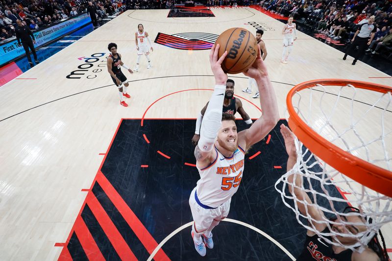 PORTLAND, OREGON - MARCH 14: Isaiah Hartenstein #55 of the New York Knicks dunks the ball during the second half against the Portland Trail Blazers at Moda Center on March 14, 2024 in Portland, Oregon. NOTE TO USER: User expressly acknowledges and agrees that, by downloading and or using this photograph, User is consenting to the terms and conditions of the Getty Images License Agreement.  (Photo by Soobum Im/Getty Images)