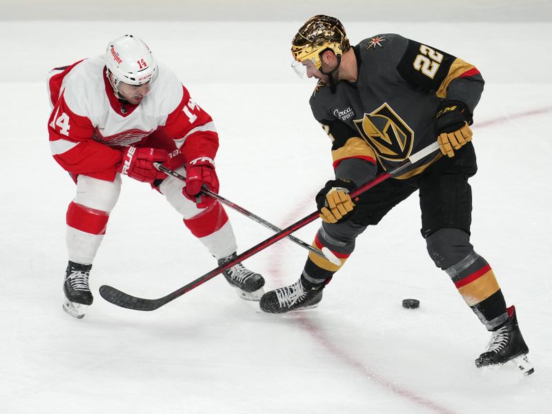 Jan 19, 2023; Las Vegas, Nevada, USA; Detroit Red Wings center Robby Fabbri (14) deflects the puck away from Vegas Golden Knights right wing Michael Amadio (22) during the third period at T-Mobile Arena. Mandatory Credit: Stephen R. Sylvanie-USA TODAY Sports