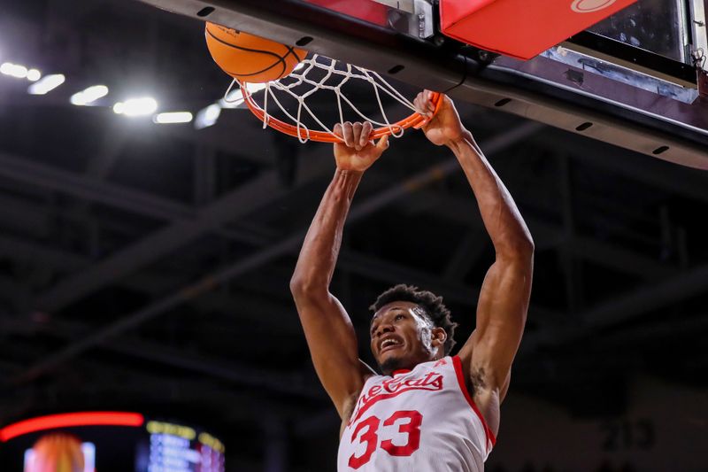 Feb 11, 2023; Cincinnati, Ohio, USA; Cincinnati Bearcats forward Ody Oguama (33) dunks on the South Florida Bulls in the first half at Fifth Third Arena. Mandatory Credit: Katie Stratman-USA TODAY Sports