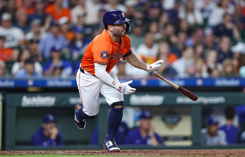 Jul 26, 2024; Houston, Texas, USA; Houston Astros second baseman Jose Altuve (27) hits a single during the sixth inning against the Los Angeles Dodgers at Minute Maid Park. Mandatory Credit: Troy Taormina-USA TODAY Sports