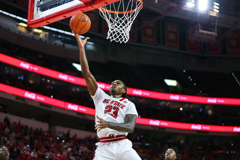 Jan 4, 2023; Raleigh, North Carolina, USA;  North Carolina State Wolfpack forward Greg Gantt (23) goes for a point during the first half against Duke Blue Devils at PNC Arena. Mandatory Credit: Jaylynn Nash-USA TODAY Sports