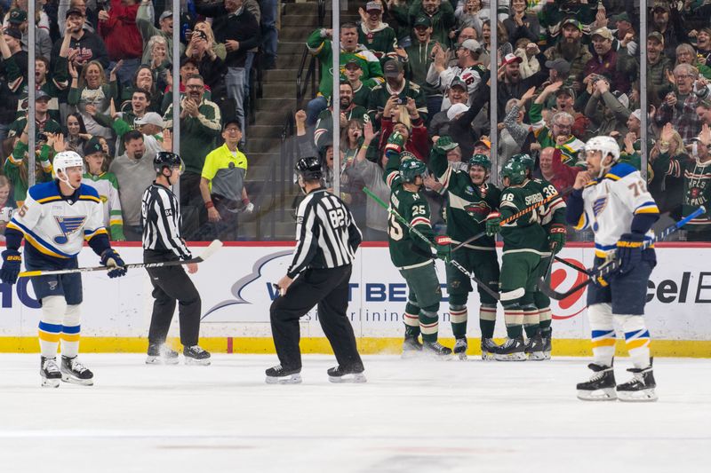 Apr 8, 2023; Saint Paul, Minnesota, USA; Minnesota Wild center Sam Steel (13) celebrates with teammates after scoring a short handed goal in the first period against the St. Louis Blues at Xcel Energy Center. Mandatory Credit: Matt Blewett-USA TODAY Sports