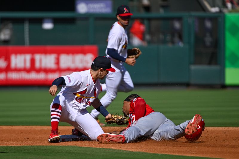 Oct 1, 2023; St. Louis, Missouri, USA;  St. Louis Cardinals second baseman Irving Lopez (55) tags out Cincinnati Reds left fielder Will Benson (30) during the second inning at Busch Stadium. Mandatory Credit: Jeff Curry-USA TODAY Sports