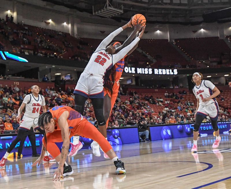 March 8, 2024; Greenville, S.C.; Ole Miss forward Tyra Singleton (22) rebounds near Florida forward Faith Dut (25) during the first quarter of the SEC Women's Basketball Tournament game at the Bon Secours Wellness Arena in Greenville, S.C. Friday, March 8, 2024. . Mandatory Credit: Ken Ruinard -USA TODAY NETWORK