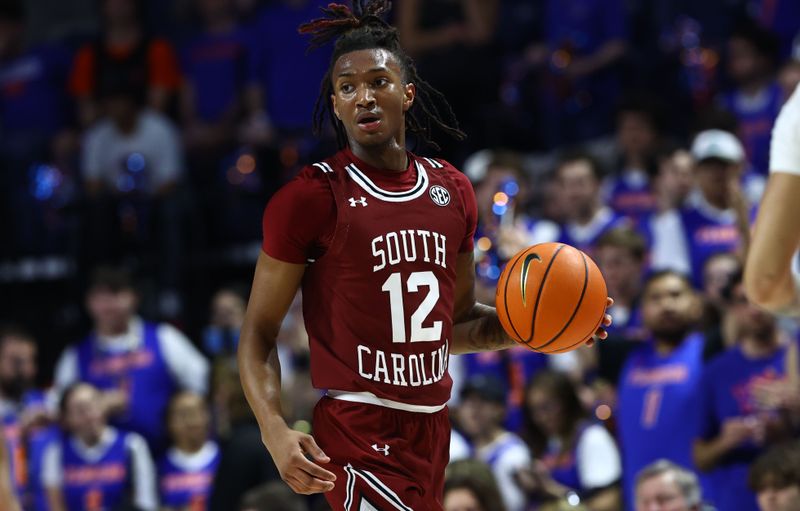 Jan 25, 2023; Gainesville, Florida, USA; South Carolina Gamecocks guard Zachary Davis (12) dribbles against the Florida Gators during the first half at Exactech Arena at the Stephen C. O'Connell Center. Mandatory Credit: Kim Klement-USA TODAY Sports