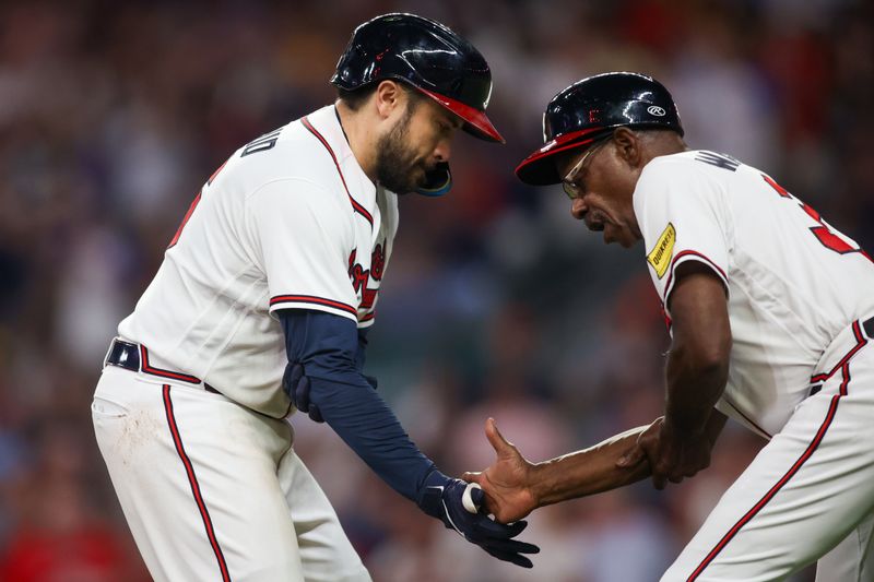 Sep 7, 2023; Atlanta, Georgia, USA; Atlanta Braves catcher Travis d'Arnaud (16) celebrates with third base coach Ron Washington (37) after a two-run home run against the St. Louis Cardinals in the seventh inning at Truist Park. Mandatory Credit: Brett Davis-USA TODAY Sports