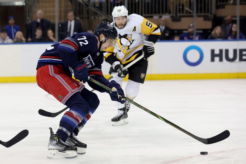 Dec 6, 2024; New York, New York, USA; New York Rangers center Filip Chytil (72) skates with the puck against Pittsburgh Penguins defenseman Kris Letang (58) during the first period at Madison Square Garden. Mandatory Credit: Brad Penner-Imagn Images