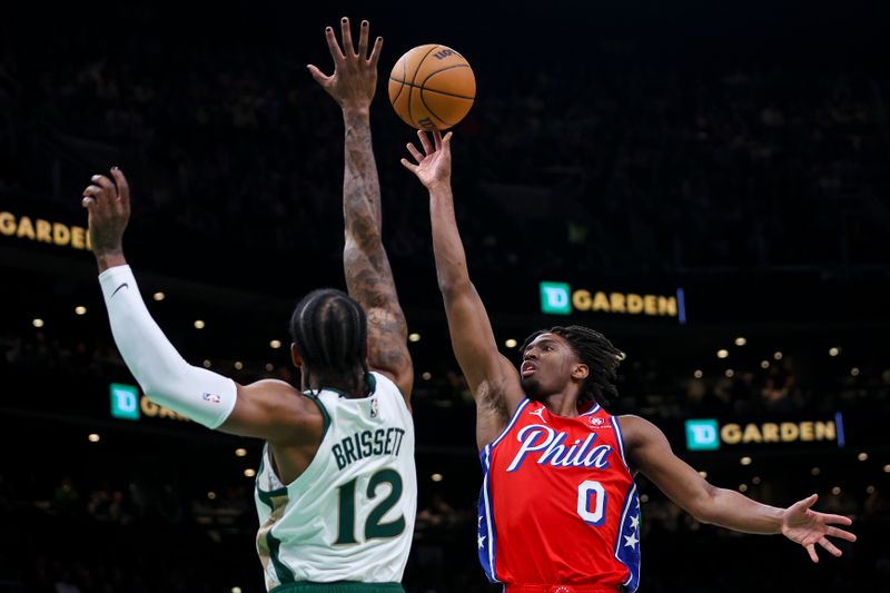 BOSTON, MA - FEBRUARY 27:  Tyrese Maxey #0 of the Philadelphia 76ers shoots over Oshae Brissett #12 of the Boston Celtics in the first quarter of a game at TD Garden on February 27, 2024 in Boston, Massachusetts. NOTE TO USER: User expressly acknowledges and agrees that, by downloading and or using this photograph, User is consenting to the terms and conditions of the Getty Images License Agreement. (Photo by Adam Glanzman/Getty Images)