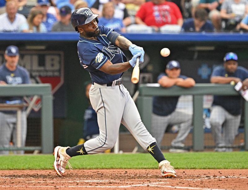 Jul 15, 2023; Kansas City, Missouri, USA;  Tampa Bay Rays left fielder Randy Arozarena (56) triples against the Kansas City Royals in the sixth inning at Kauffman Stadium. Mandatory Credit: Peter Aiken-USA TODAY Sports