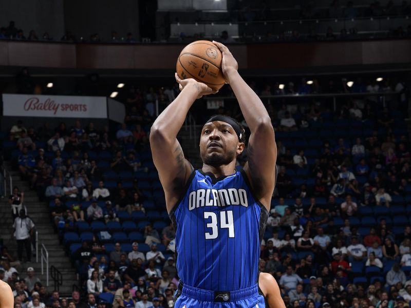 ORLANDO, FL - FEBRUARY 29: Wendell Carter Jr. #34 of the Orlando Magic shoots a free throw during the game against the Utah Jazz on February 29, 2024 at Amway Center in Orlando, Florida. NOTE TO USER: User expressly acknowledges and agrees that, by downloading and or using this photograph, User is consenting to the terms and conditions of the Getty Images License Agreement. Mandatory Copyright Notice: Copyright 2024 NBAE (Photo by Fernando Medina/NBAE via Getty Images)