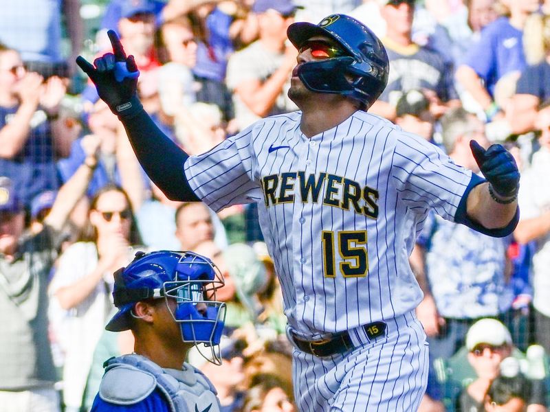 Oct 1, 2023; Milwaukee, Wisconsin, USA;  Milwaukee Brewers right fielder Tyrone Taylor (15) reacts after hitting a solo home run in the sixth inning as Chicago Cubs catcher Miguel Amaya (6) looks on at American Family Field. Mandatory Credit: Benny Sieu-USA TODAY Sports