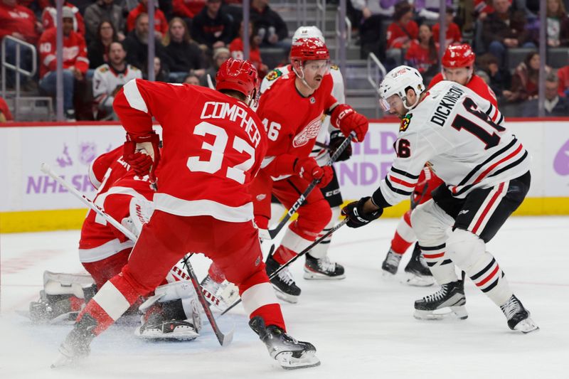 Nov 30, 2023; Detroit, Michigan, USA;  Detroit Red Wings goaltender Alex Lyon (34) makes a save on Chicago Blackhawks center Jason Dickinson (16) in the first period at Little Caesars Arena. Mandatory Credit: Rick Osentoski-USA TODAY Sports