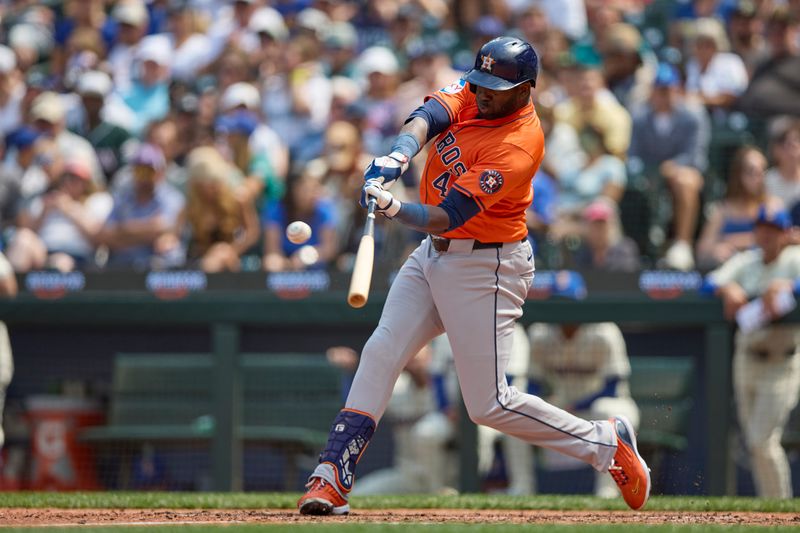 Jul 21, 2024; Seattle, Washington, USA; Houston Astros designated hitter Yordan Alvarez (44) hits an RBI triple against the Seattle Mariners during the sixth inning at T-Mobile Park. Mandatory Credit: John Froschauer-USA TODAY Sports