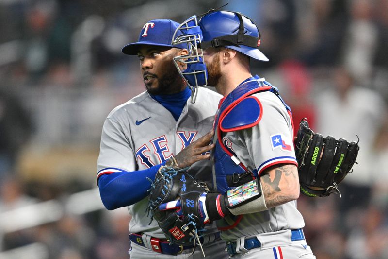 Aug 26, 2023; Minneapolis, Minnesota, USA; Texas Rangers relief pitcher Aroldis Chapman (45) and catcher Mitch Garver (18) react after the game against the Minnesota Twins at Target Field. Mandatory Credit: Jeffrey Becker-USA TODAY Sports