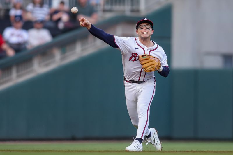 May 8, 2025; Atlanta, Georgia, USA; Atlanta Braves shortstop Nick Allen (2) throws a runner out at first against the Cincinnati Reds in the second inning at Truist Park. Mandatory Credit: Brett Davis-Imagn Images
