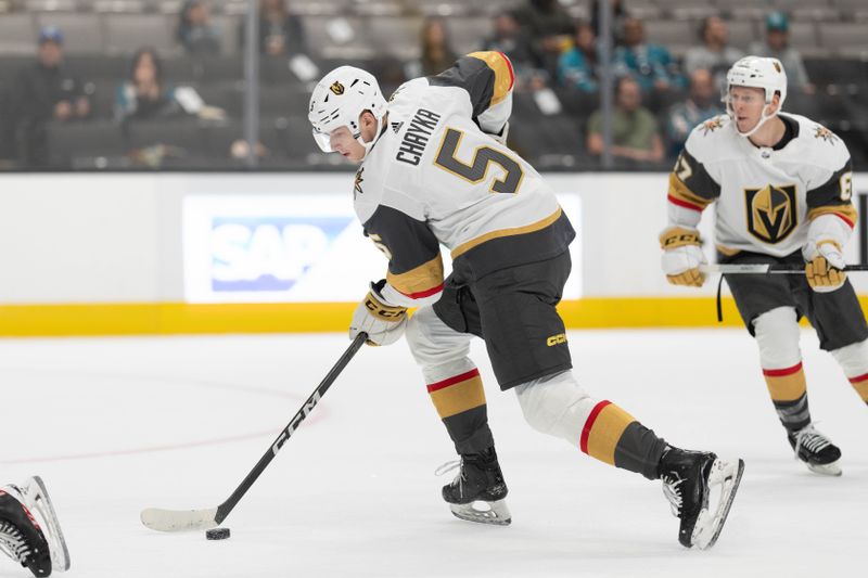 Sep 24, 2023; San Jose, California, USA;  Vegas Golden Knights defender Daniel Chayka (5) controls the puck during the first period against the San Jose Sharks at SAP Center at San Jose. Mandatory Credit: Stan Szeto-USA TODAY Sports